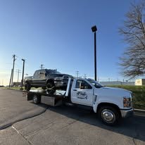 T&Z tow truck transporting a vehicle