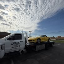 Tow truck carrying sports car